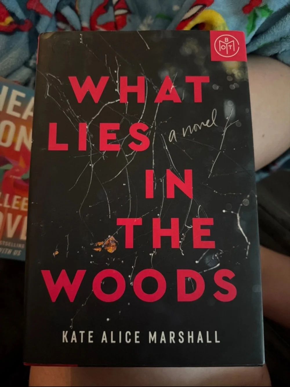 What Lies in the Woods — Black & Red Hardcover by Kate Alice Marshall